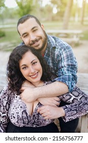 Portrait Of A Smiling Overweight Young Couple Outcdoors. Confident And Happy People.