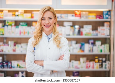 Portrait of a smiling pharmacist with arms crossed at modern pharmacy. - Powered by Shutterstock