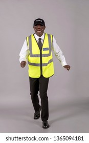  Portrait Of A Smiling Police Officer In Uniform Walking Toward The Camera.