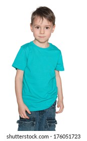 A portrait of a smiling preschool boy in blue shirt on the white background