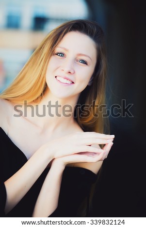 Similar – Image, Stock Photo Smiling young woman in urban background