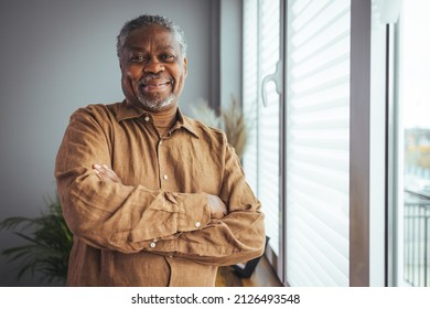Portrait of smiling senior african american man at home near window. Portrait Of Happy Senior Man At Home. Happy mature African American man smiling - Shutterstock ID 2126493548