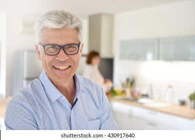 Portrait of smiling senior man with eyeglasses 