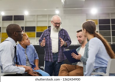 Portrait Of Smiling Senior Man Giving Speech During Therapy Session In Support Group, Copy Space