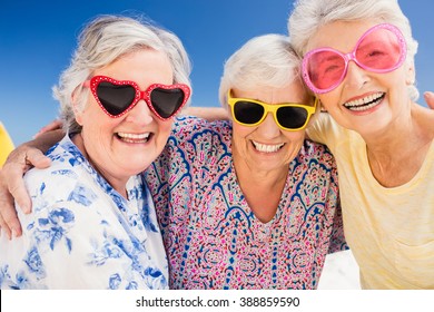 Portrait Of Smiling Senior Woman On The Beach