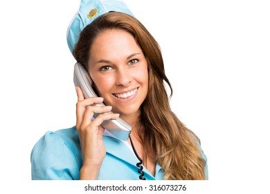 Portrait Of A Smiling Stewardess Talking On The Phone