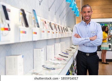 Portrait Of A Smiling Store Manager In A Phone Shop