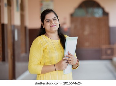 portrait of Smiling teacher in School corridor	
 - Shutterstock ID 2016644624