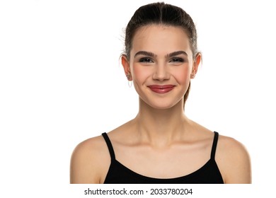 Portrait Of A Smiling Teen Girl With Closed Mouth On A White Background