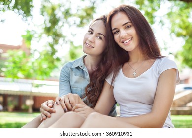 Portrait of smiling teen girls in a park