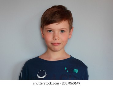 Portrait Of Smiling Teenager Boy With Blue Eyes And Brown Hair