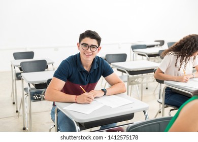 Portrait Of Smiling Teenager During Admission Test In University