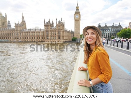 Portrait of smiling tourist woman in London, United Kingdom