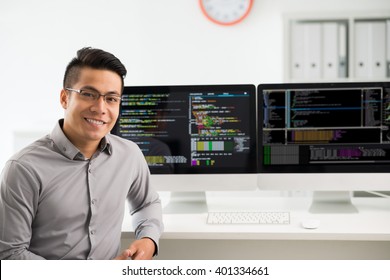 Portrait of smiling Vietnamese software engineer