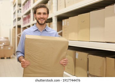 Portrait of a smiling warehouse keeper at work