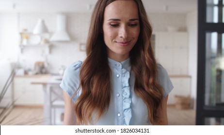 Portrait Of Smiling Woman Coming Closer To Husband In Slow Motion. Beautiful Wife Massaging Man Shoulders At Home. Business Man Working On Smartphone At Remote Workplace.