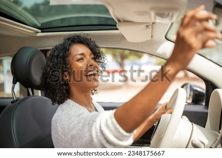 Portrait smiling woman driving car