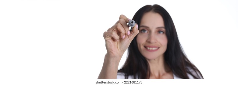 Portrait Of Smiling Woman Holding Marker And Writing Something In Air. Young Cheerful Female Drawing Something On Virtual Screen. People Lifestyle Concept