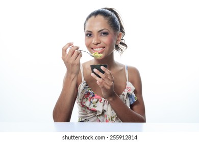 Portrait Of Smiling Woman Isolated On White Studio Shot Eating Avocado