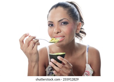 Portrait Of Smiling Woman Isolated On White Studio Shot Eating Avocado