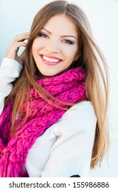 Portrait of smiling woman wearing woolen accessories