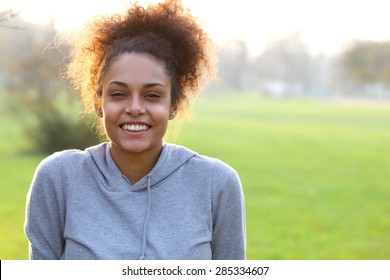 Portrait Of A Smiling Young African American Woman Outdoors