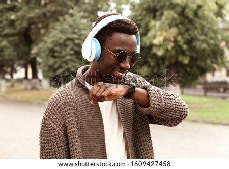 Similar – Young happy black man is listening to music