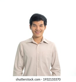 Portrait Of Smiling Young Asian Business Man Standing Isolated On White Background. People Lifestyle.