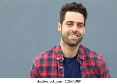Portrait of smiling young bearded man with copy space