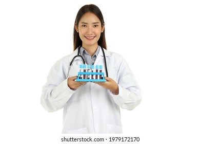 Portrait Of Smiling Young Beautiful Asian Female Medical Doctor In Lab Coat With Stethoscope, Holding Rack Of Blood Test Tube Samples Isolated On White Background. 