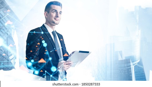 Portrait Of Smiling Young Businessman Using Tablet Computer In Blurry City. Concept Of Technology And Internet. Toned Image Double Exposure Of Graph