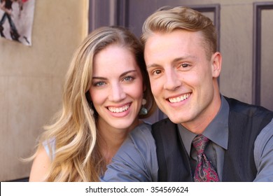 Portrait Of Smiling Young Couple At Home