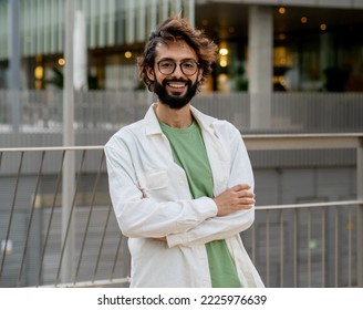 Portrait of a smiling young entrepreneur looking at camera in a financial district. Italian man - Powered by Shutterstock