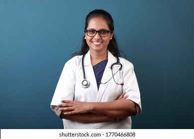 Portrait Of A Smiling Young Female Doctor Of Indian Origin