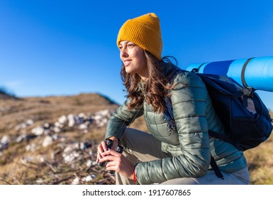 Portrait Of A Smiling Young Female Hiking In The Mountain.	