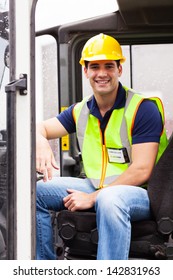 Portrait Of Smiling Young Forklift Driver