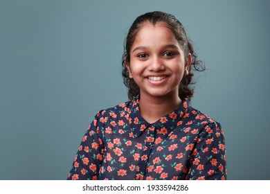 Portrait of a smiling young girl of Indian ethnicity