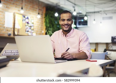 Portrait Of Smiling Young International Student Preparing For Upcoming Quality Control Testing In College To Continue Education Happy To Pass Online Practicing Quiz Using Laptop Computer And Wifi