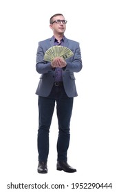 Portrait Of Smiling Young Man Holding Fanned US Paper Currency