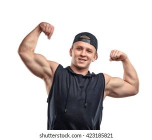 Portrait Of Smiling Young Muscular Guy Shows Arm Muscles - Biceps. Cutout Portrait. Self Improvement. Happiness. Body Power. Healthy Lifestyle. Fitness And Sport. 