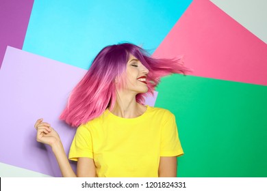 Portrait smiling young woman and dyed straight hair colorful background  Trendy hairstyle design 