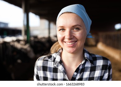 Portrait Of Smiling Young Woman Engaged In Dairy Farm