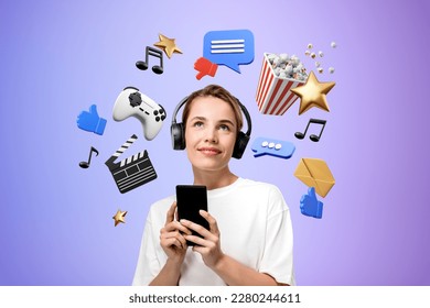 Portrait of smiling young woman using smartphone and headphones standing over purple background with online entertainment icons