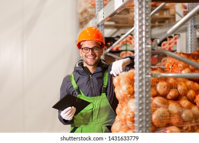 Portrait Of A Smiling Young Worker At Organic Food Production Warehouse.