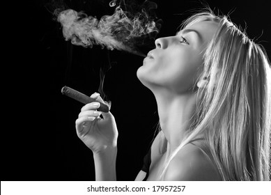 portrait of smoker beautiful young woman with cigar