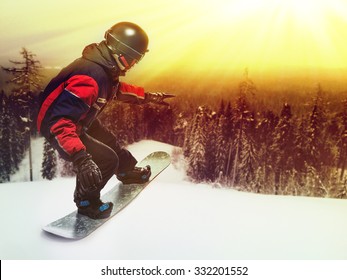 Portrait of snowboarder doing extreme trick on the mountain. - Powered by Shutterstock