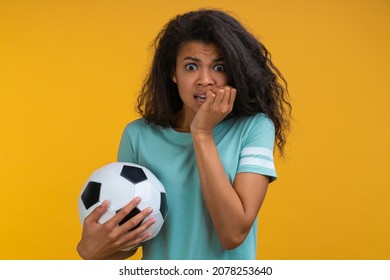 Portrait Of Soccer Fan Girl Watching Play Live Broadcast, Supporting Favourite Team And Biting Her Nail Feeling Nervous About Final Score.