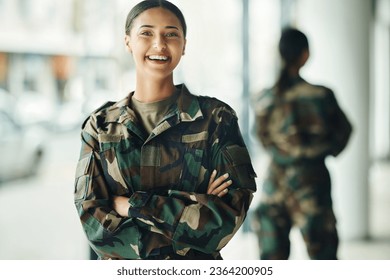 Portrait, soldier and woman with arms crossed, military and security with a smile, confident and power. Face, person and warrior with pride, camouflage and protection with training, happy and war - Powered by Shutterstock