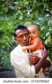 Portrait Of South Asian Cute Adorable Baby Boy With His Grandfather 