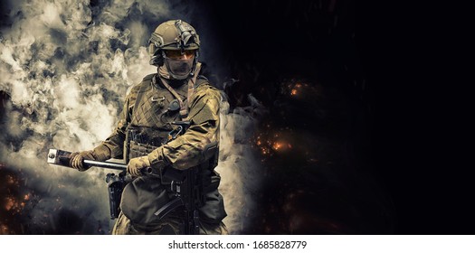 Portrait Of A Special Forces Soldier Waving A Sledgehammer To Smash An Obstacle. The Concept Of Military Units. Computer Games. Mixed Media